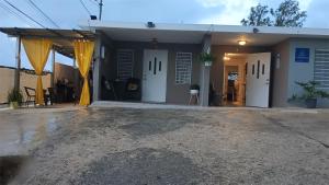 a house with white doors and a driveway at Casa Dona Guilla 1 in Luyando