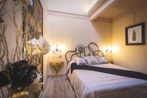 Posteľ alebo postele v izbe v ubytovaní B&B Il Sogno del Pinzagrilli + 37 fotografií