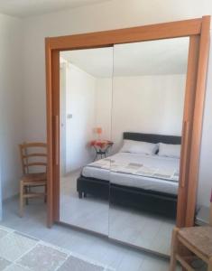 Ein Bett oder Betten in einem Zimmer der Unterkunft Studio für 4 Personen ca 60 qm in Porto Torres, Sardinien Sassarese