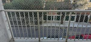 a metal gate with a fence on a porch at Apartamento PRAIA in Cabo Frio