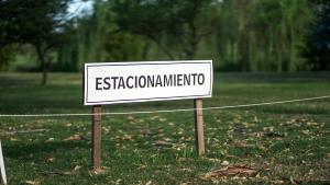 a sign that says essexatownmite on a field at Complejo Enrique Joaquin in Mercedes
