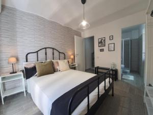 Postel nebo postele na pokoji v ubytování CASA DINA - Fondi Vertice Rooms