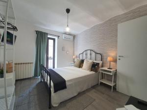 Postel nebo postele na pokoji v ubytování CASA DINA - Fondi Vertice Rooms