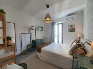 Postel nebo postele na pokoji v ubytování CASA DINA - Fondi Vertice Rooms