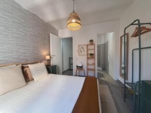 Postel nebo postele na pokoji v ubytování CASA DINA - Fondi Vertice Rooms