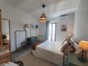 Postel nebo postele na pokoji v ubytování CASA DINA - Fondi Vertice Rooms