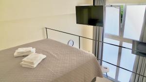 Postel nebo postele na pokoji v ubytování Piraeus Relax