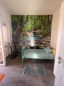 a bedroom with a waterfall mural on the wall at Casa Biancola, Novara Centro in Novara