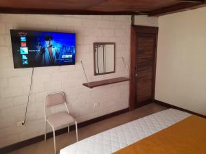 TV a/nebo společenská místnost v ubytování Casa Verde Descanso 1