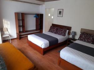 Postel nebo postele na pokoji v ubytování Casa Verde Descanso 1