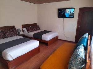 Postel nebo postele na pokoji v ubytování Casa Verde Descanso 1