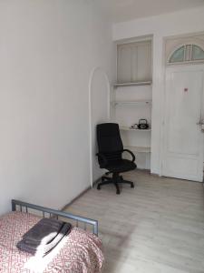 a bedroom with a desk and a chair and a bed at Room in Guest room - Chambre A Bruxelles a in Brussels