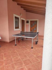 a ping pong table in the middle of a room at Ferienhaus mit Privatpool für 8 Personen ca 120 qm in Laginji, Istrien Binnenland von Istrien in Žminj