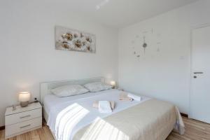 Postel nebo postele na pokoji v ubytování Ferienwohnung für 4 Personen ca 65 qm in Funtana, Istrien Istrische Riviera