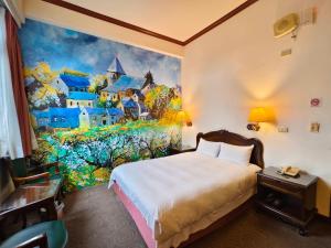 Postel nebo postele na pokoji v ubytování East Commercial Affairs Hotel