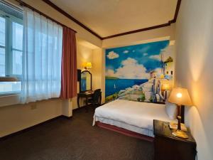 Postel nebo postele na pokoji v ubytování East Commercial Affairs Hotel