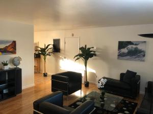 a living room with a couch and a table at Apartment close to Tech Giants, fast internet in East Palo Alto