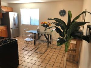a kitchen with a table and a potted plant at Apartment close to Tech Giants, fast internet in East Palo Alto