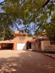 a house with a driveway in front of it at HaciendO in Somone