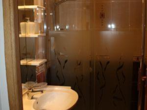 a bathroom with a sink and a shower with a mirror at Charmant gîte historique avec terrasse, salle de jeux, et recharge électrique – proche Vittel & Contrexéville - FR-1-589-219 in Serocourt +22 photos
