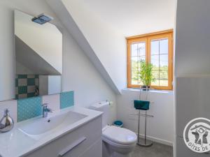 a white bathroom with a sink and a toilet at Gîte familial avec piscine privée, proche d'Angers et du Zoo de La Flèche - FR-1-622-65 in Baugé-en-Anjou +27 photos