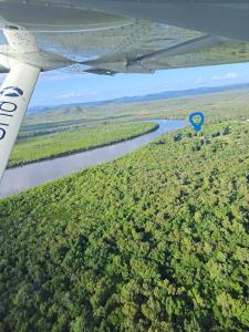 an aerial view of a river with a blue marker at Cooktown Fishing Haven in Cooktown