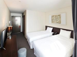 Postel nebo postele na pokoji v ubytování Hotel K-Tree Pyeongtaek