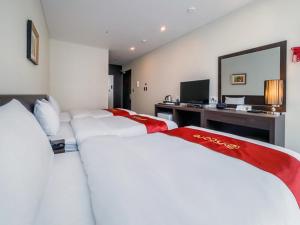 Postel nebo postele na pokoji v ubytování Hotel K-Tree Pyeongtaek