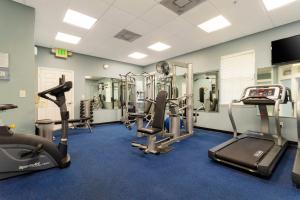 a gym with treadmills and elliptical machines at Our Happy Place in Kissimmee