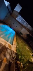 an overhead view of a swimming pool at night at Casa en alquiler temporario Formosa in Formosa