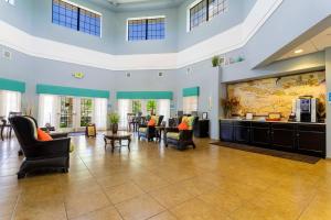 a large lobby with chairs and a large map on the wall at Our Happy Place in Kissimmee +27 photos