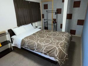 Postel nebo postele na pokoji v ubytování GuestHouse Guu