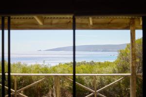 a view of the ocean from a window at Chandlers Smiths Beach Villas in Yallingup