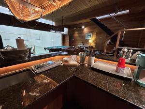 a kitchen with a sink and a counter top at Charming Hidden Gem- Ocean View and Marina in Campbell River