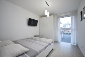 Postel nebo postele na pokoji v ubytování Apartament Premium SM Klifowa