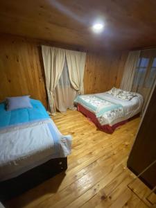 Katil atau katil-katil dalam bilik di Refugio Entremontañas