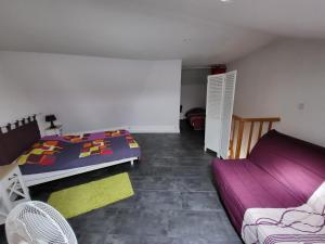 En eller flere senge i et værelse på Appartement Les Sables-d'Olonne, 3 pièces, 5 personnes - FR-1-92-571