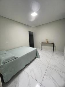 Ένα ή περισσότερα κρεβάτια σε δωμάτιο στο Casa com piscina e churrasqueira