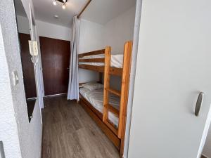a hallway with bunk beds in a room at Studio cabine à Sète avec terrasse et climatisation - FR-1-338-106 in Sète