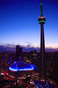 a view of the space needle at night at Downtown Dream in Toronto