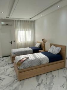 Postel nebo postele na pokoji v ubytování Rabat Agdal Room in shared apartment