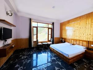 Postel nebo postele na pokoji v ubytování Hawk Eye Resort + 37 fotografií