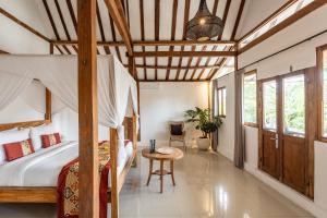 a bedroom with a bunk bed and a table at 5 Bedroom Entire Villa in Berawa Canggu in Dalung +35 photos