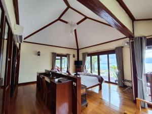a bedroom with a bed and a desk at Koh Mook Sivalai Beach Resort in Ko Mook