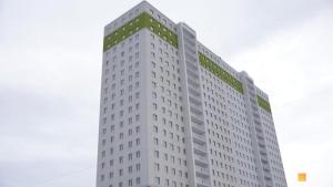 a tall white building with a lot of windows at Sea 407 in Odesa
