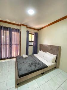 a bedroom with a large bed in a room at Exclusive Beachfront House at San Juan La Union in San Juan +23 photos