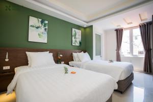 Giường trong phòng chung tại Nature Hotel - Dalat 3