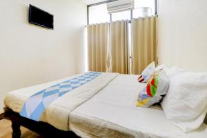 Ένα ή περισσότερα κρεβάτια σε δωμάτιο στο Super Hotel O Together