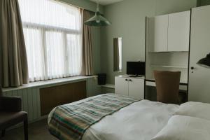 Hotel Kempenrust房間的床