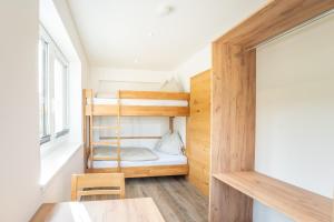 Postelja oz. postelje v sobi nastanitve Appartementhaus Longa Stubn